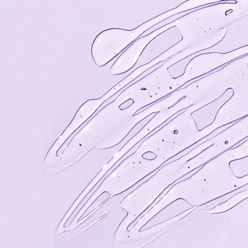 upclose of natural wholesale's bulk serum base on purple background
