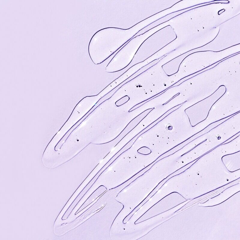 upclose of natural wholesale's bulk serum base on purple background